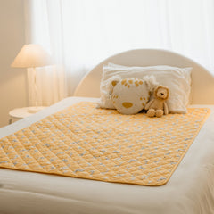 Rudie Baby leakproof bed guard on bed, lifestyle photo
