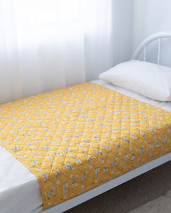 Rudie Baby leakproof bed guard on bed, side view