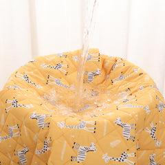 Rudie Baby leakproof bed guard in Giraffes print, hanging display