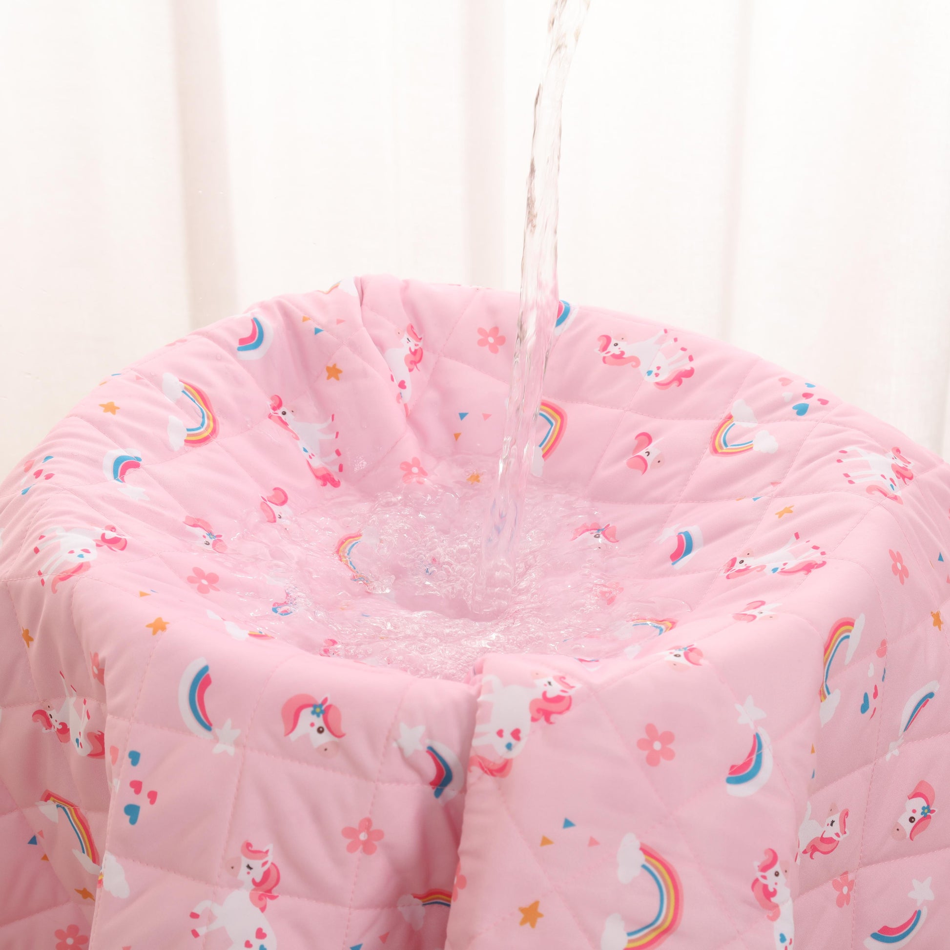 Rudie Baby leakproof bed guard in Unicorns print, hanging display