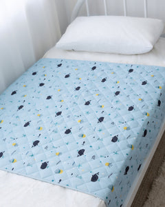Rudie Baby leakproof bed guard on bed, lifestyle photo